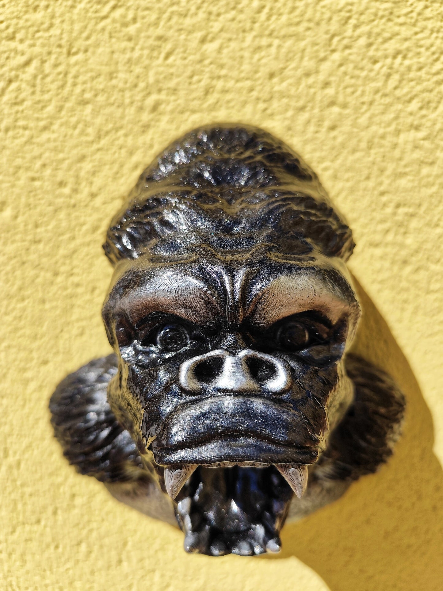 Gorilla head wall sculpture with chest detail