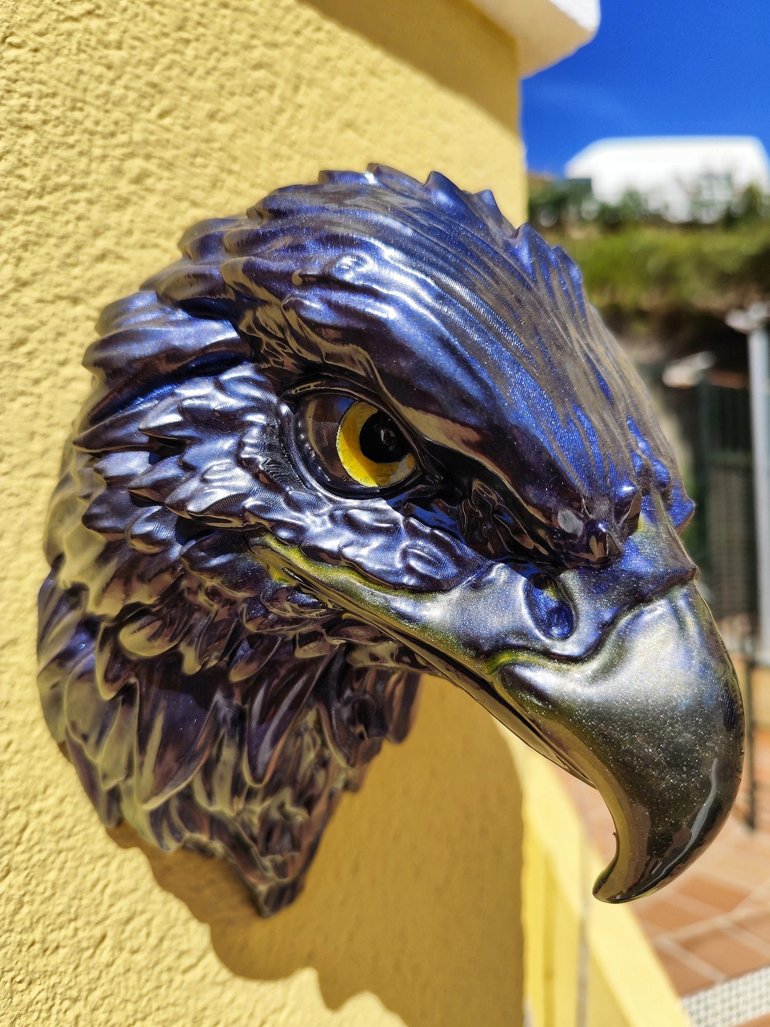 Hand-painted eagle head wall sculpture with metallic blue finish