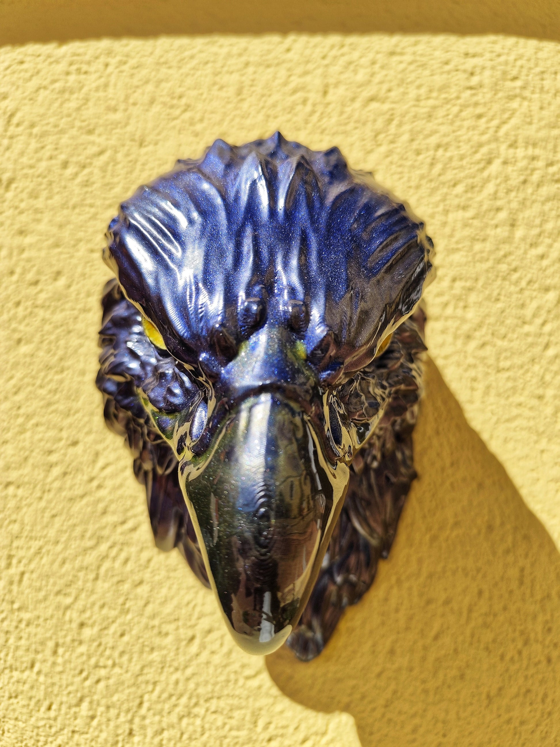 Detailed eagle head wall decor in blue metallic tones