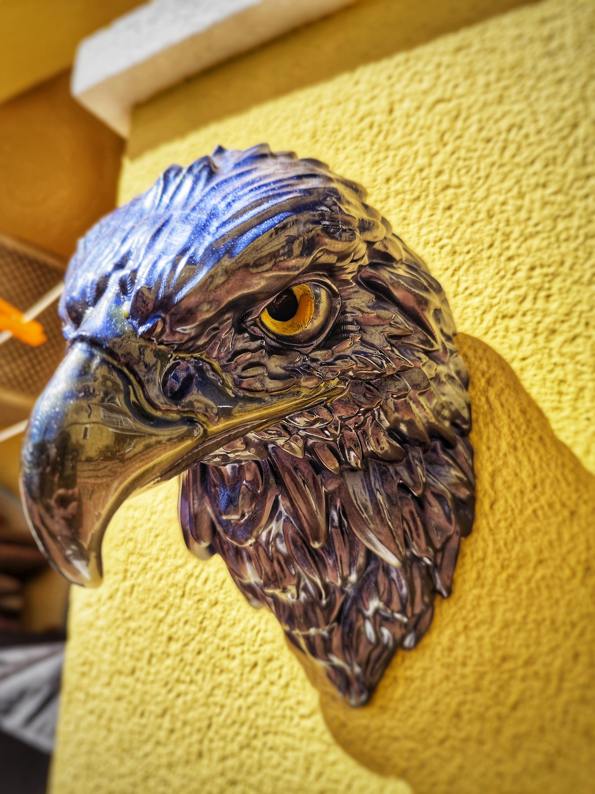 Realistic eagle head wall art with shimmering blue patina